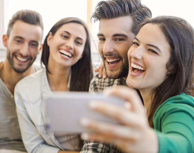 Two pairs of couples with Cosmetic Dentistry in Clayton, NC