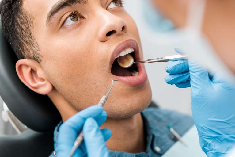 A young man getting his Teeth Cleaned in Clayton, NC