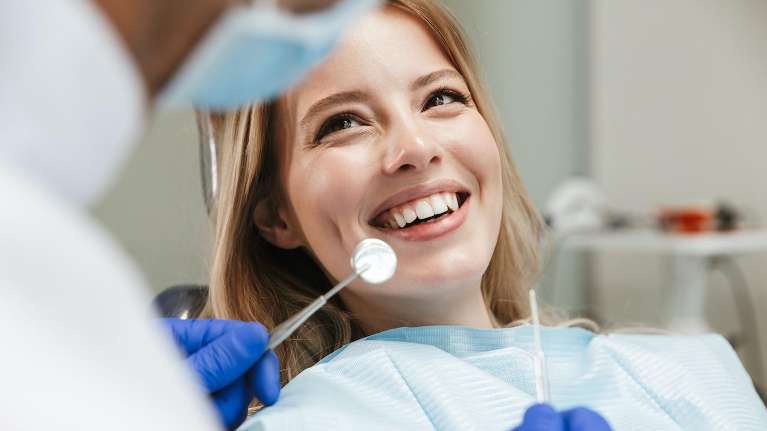 A young woman getting a Caring and Comforting Dental Cleanings in Clayton, NC