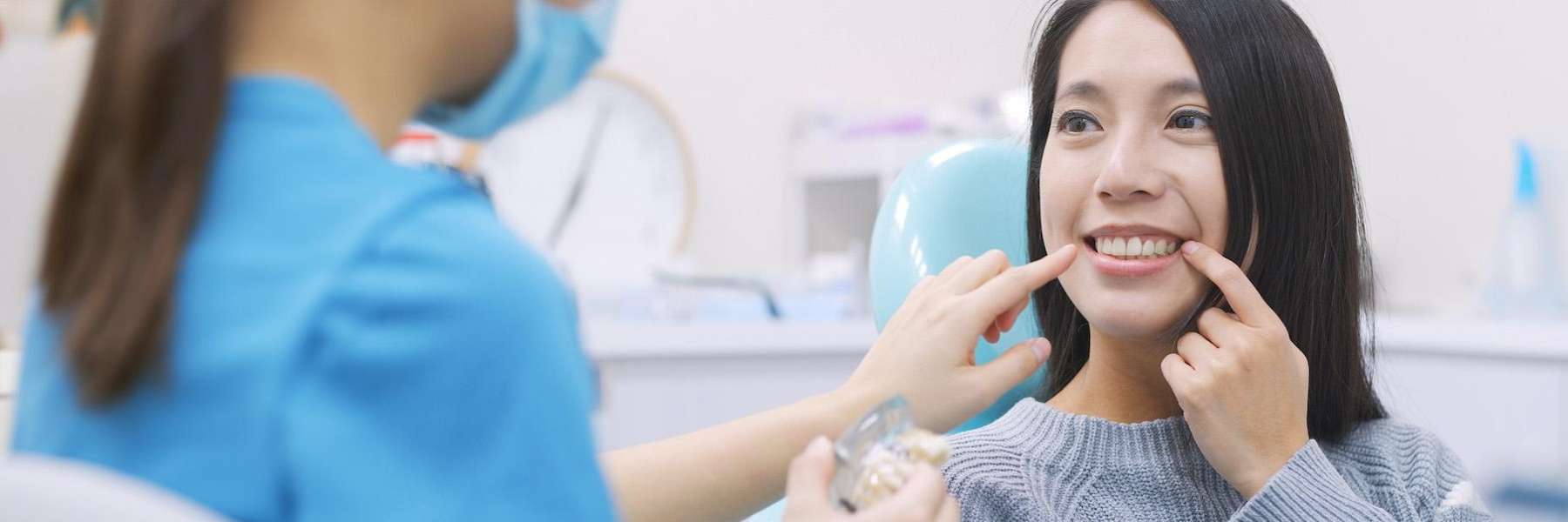 A woman with emergency dental appointment in Clayton, NC.
