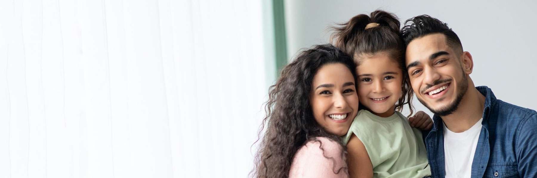 A family smiling after a Comprehensive Family Dentistry treatment in Clayton, NC