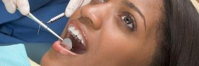 woman during dental emergency exam in clayton nc