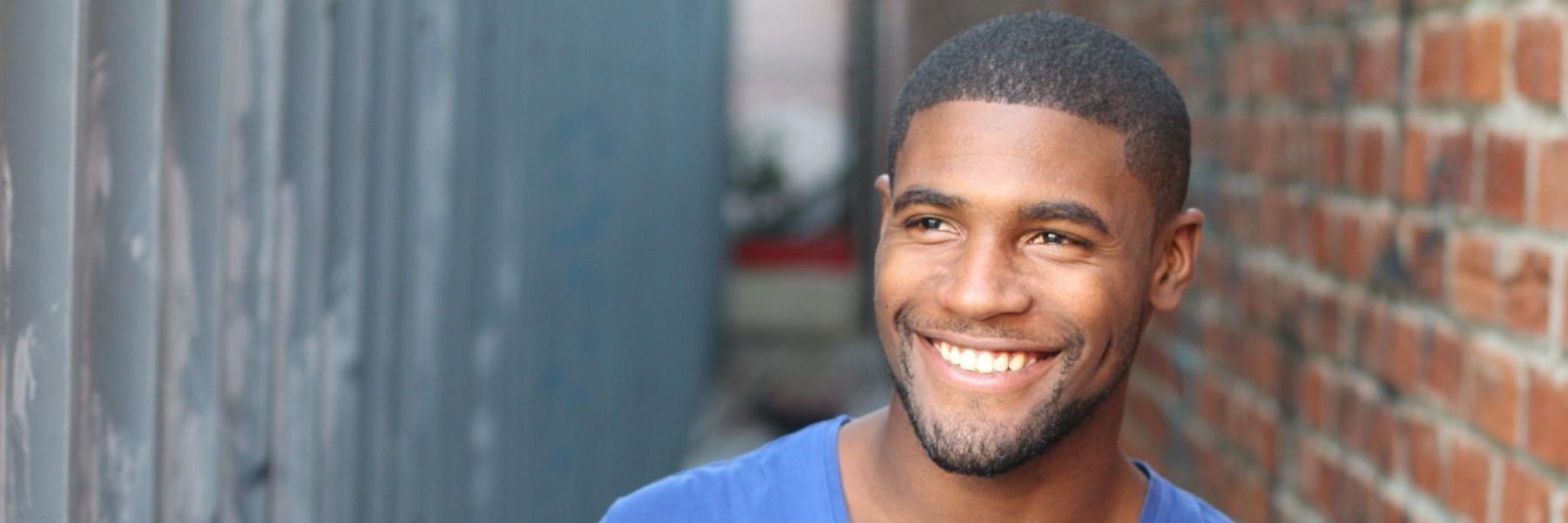 smiling man with dental crowns in clayton nc